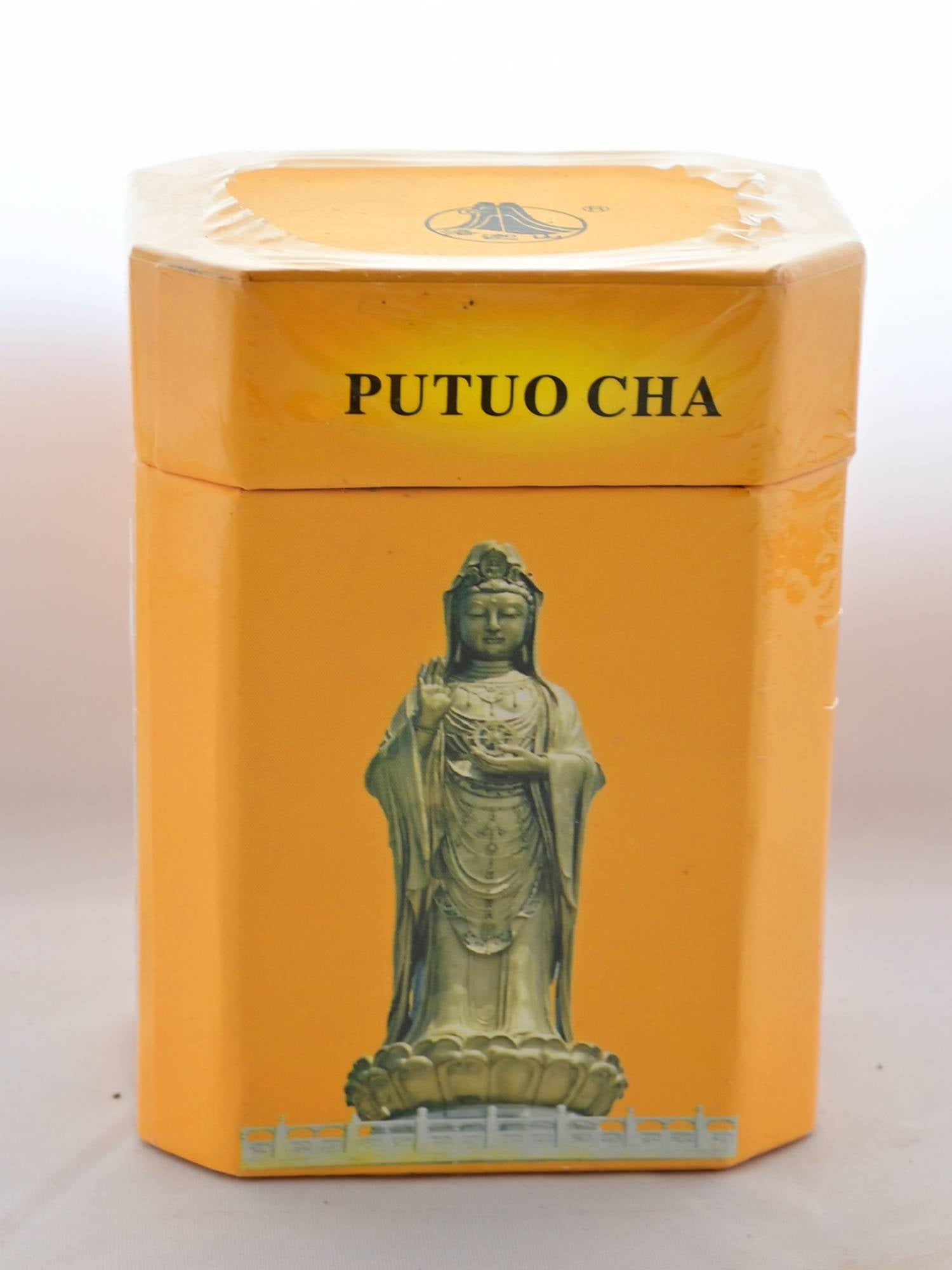 The Putuo Fo Cha box is orange and squared. On the lid, black text reads: "Putuo Cha." below, on the body, a statue of a woman holding her right palm up and adorned with jewelry is shown.