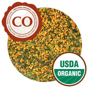 A close-up of Genmaicha leaves. The tea appears to be a 50-50 blend of caramel-colored toasted ice and narrow, dark green leaves. It has the Certified Organic and USDA Organic logos.