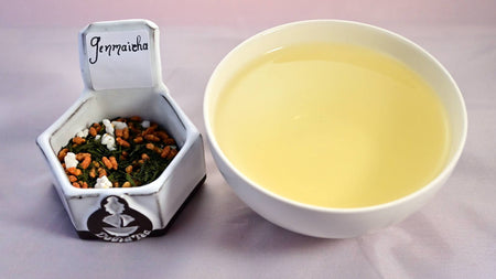 A combination image of tea leaves on the left, with toasted and popped rice kernels, and a yellow steeped tea in cup on the right.