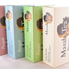 Four boxes standing on their sides facing upwards. From left to right, text reads: "Punjab, Bengal, Kerala, Masala Tea Organic."