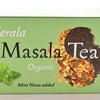 The Kerala Masala Tea box is pastel green. It features masala spices and rolled black tea together in a yin-yang shape, with Mint Nana leaves toward the bottom left. Text reads: "Kerala. Masala Tea. Organic. Mint Nana added."