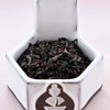 A close-up of Vanilla Tea leaves. The leaves are black, and slightly broken, making them smaller and less curled than other black teas. 